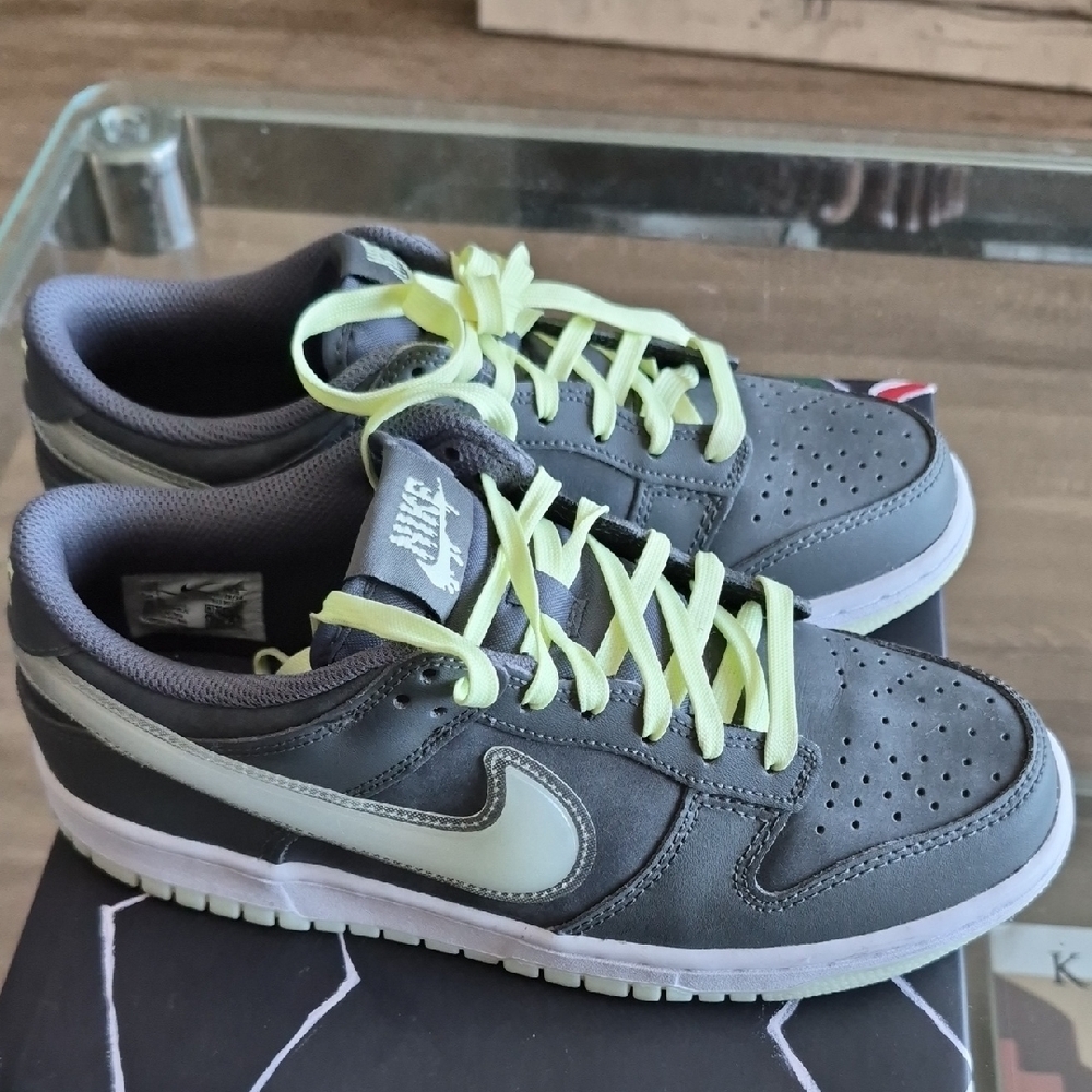 Nike Dunk Low Youth Low-Top Sneakers in Gray with Glow -in The Dark Accents.